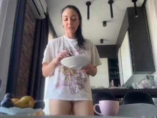 Sexy fit brunette does housework without panties.