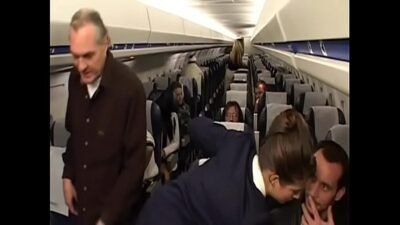 Randy pilot fondles sexy brunette in the cockpit